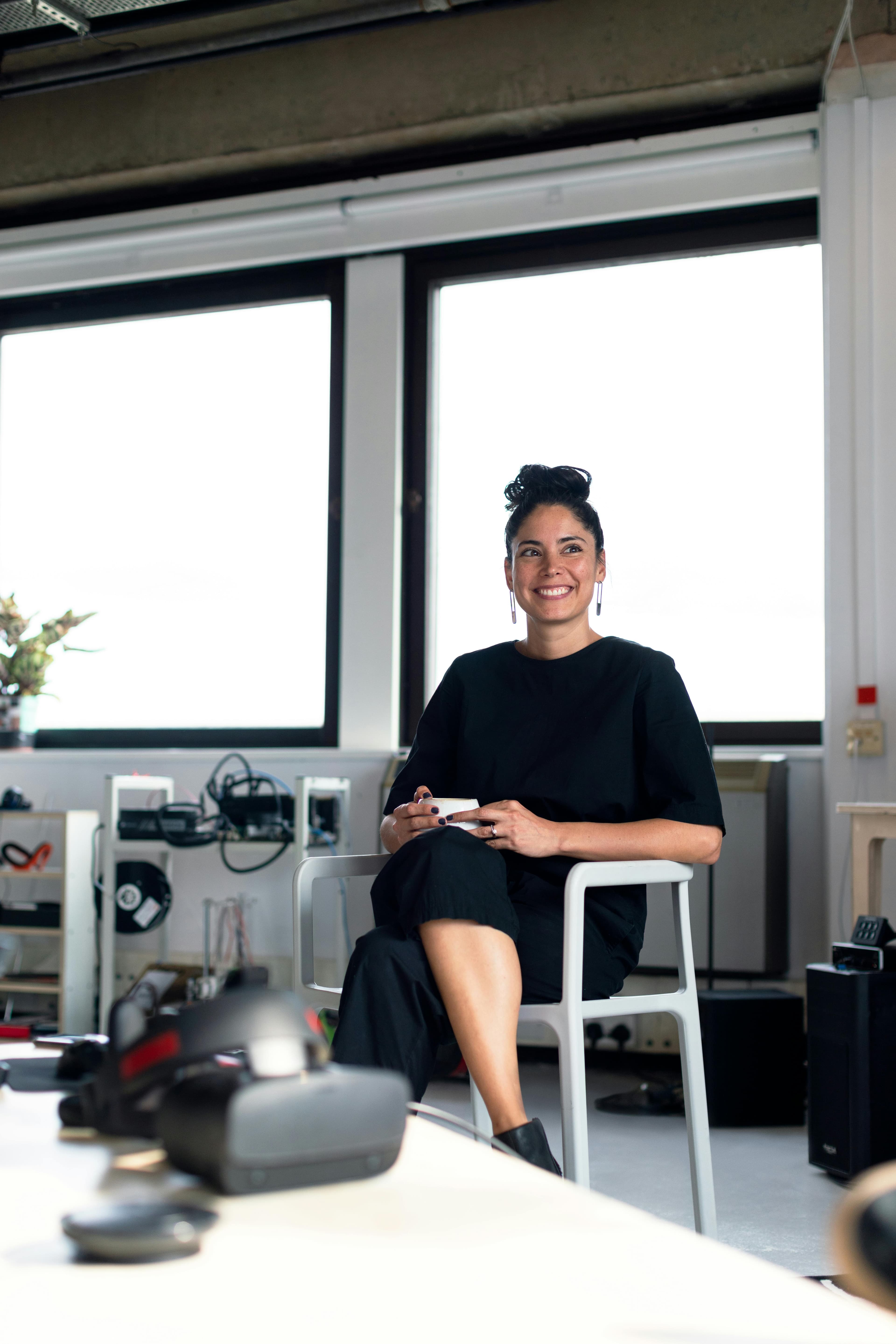 Confident professional woman in a modern workspace